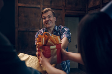 Portrait of man taking birthday present