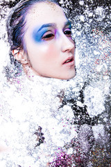 Woman water art make up. Natural light. Dark style. Artistic natural background. Fashion model girl colorful face paint.