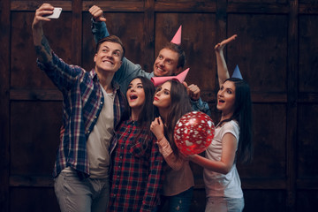 Best friends doing selfie in birthday party