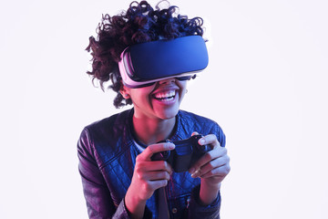 Laughing black teenager playing VR game © kegfire