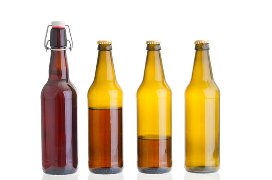 Row of beer bottles isolated on white background