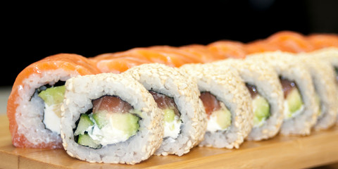 Overhead japanese sushi food. Maki ands rolls with tuna, salmon, shrimp, crab and avocado. Top view of assorted sushi, all you can eat menu. Rainbow sushi roll, uramaki, hosomaki and nigiri.