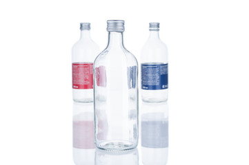 Naklejka premium Empty glass bottles on white background