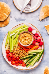 Hummus with various fresh raw vegetables.