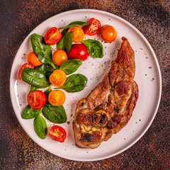 Roasted turkey steak with salad.