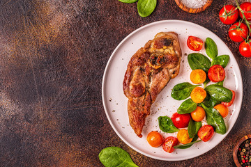 Roasted turkey steak with salad.