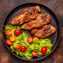 Roasted turkey steak with salad.