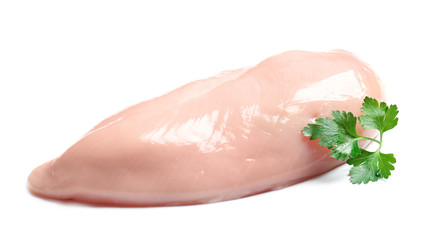 Raw chicken breast with parsley on white background