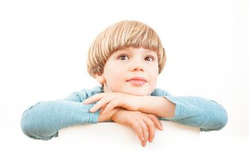 Imaginative and  curious boy - Thoughtful dreamer - Daydreaming - Looking up on white background – Isolated portrait - 244579656