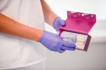 girl do plastic operation in medical clinic; doctor does lip augmentation surgery; injecting...