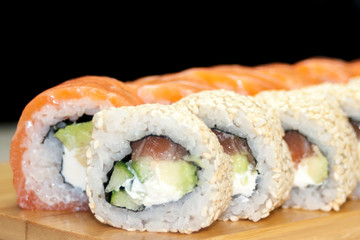 Overhead japanese sushi food. Maki ands rolls with tuna, salmon, shrimp, crab and avocado. Top view of assorted sushi, all you can eat menu. Rainbow sushi roll, uramaki, hosomaki and nigiri.