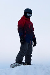 Fototapeta na wymiar snowboarder on a ski slope in the snow