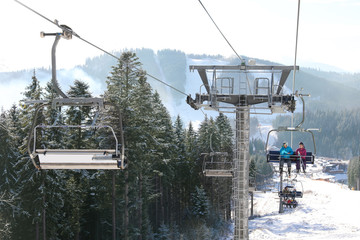 Beautiful mountain landscape with chairlift. Winter vacation