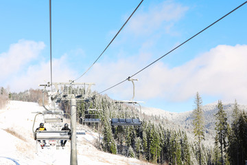 Beautiful mountain landscape with chairlift. Winter vacation