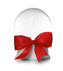 Beautiful Christmas snow globe with red bow knot on white background