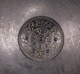 medieval shield on metallic background