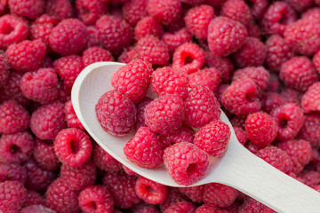 Raspberries. Eat berries with a spoon. Close-up, top view.