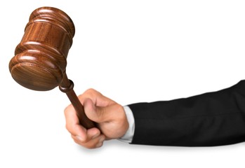 Hand Holding the Gavel