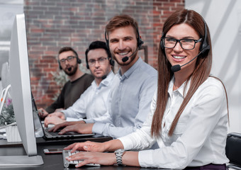 group of call center specialists work with clients