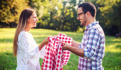 Couple enjoying picnic together. Love and tenderness, dating, romance, lifestyle concept