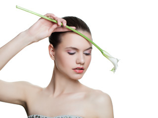 Fototapeta premium Fashion girl with white calla lily flower isolated on white background