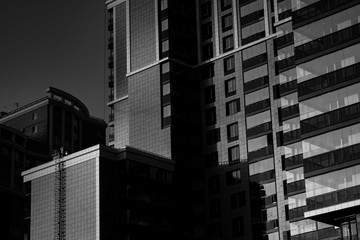 Fototapeta premium The delightful architecture of the city against the blue sky. Bright facades of buildings. New design solutions. 