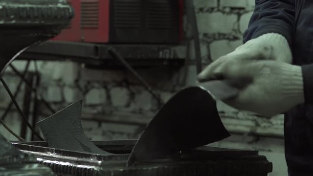 Man The Blacksmith Prepared To Grind The Forged Billets