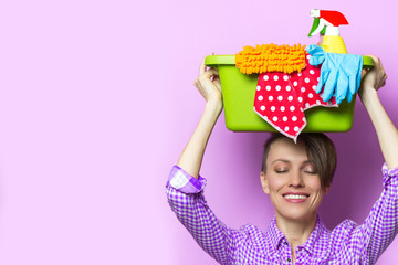 Woman with house supplies ready to to clean room. Spring cleaning