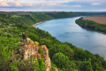 tourist on the rock. girl meditates on nature. canyon of the picturesque river