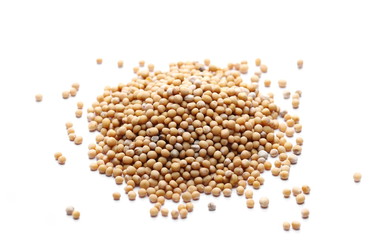 Yellow mustard seeds macro isolated on white background