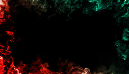 Red vs Green colorful smoke at the edges frame. Effect for film , text or space