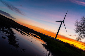 Wind turbines at sunset