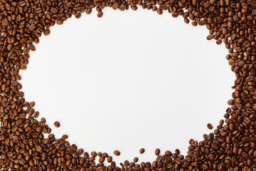 Roasted coffee beans on white background