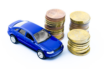 Model of blue car and coins on a white background. Isolated toy car and money. Financial concept....