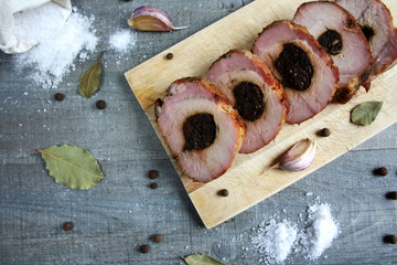 Roasted pork loin with plum sprinkled with spices