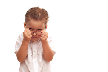 Little smart boy first grader in glasses