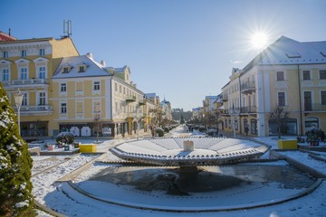 Snow winter in the center of the small spa town Frantiskovy Lazne (Franzensbad) near historical...