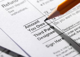 Sharpened Pencil on the Amout Owe Documents - Close Up