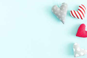 Valentine's Day background. Beautiful hearts on pastel blue background. Valentine day concept, design. Flat lay, top view, copy space.