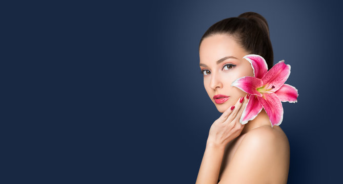 Brunette beauty with colorful flower.