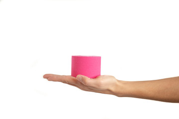 Woman hand holding kinesiotape isolated on white background