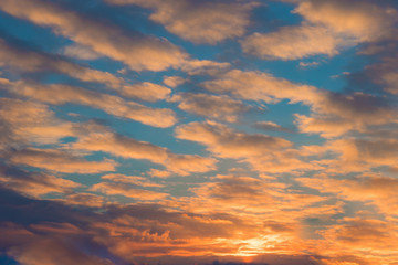 Naklejka na ściany i meble Sky background with clouds on sunrise