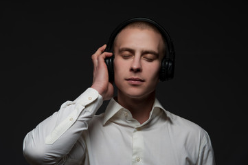 Businessman enjoying relaxing music in headphones