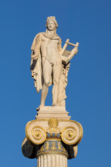 Sunset view of Statue of the ancient Greek god Apollo in front of Academy of Athens, Attica, Greece