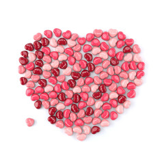Red, rose, pink heart-shaped candies on white background