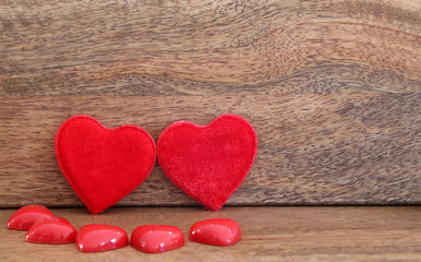 Fototapeta premium Valentine's Day background with two big red hearts, small hearts and dried roses, mother's day background