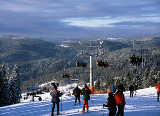 Beskid Sudecki mountains, Poland: January, 2011: skiers in Wierchomla