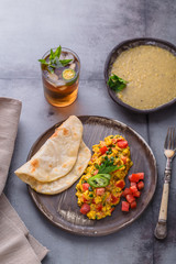 Scrambled eggs with onion and indian spices, indian cuisine