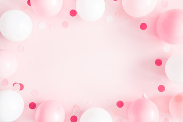 Balloons on pastel pink background. Frame made of white and pink balloons. Birthday, valentines...