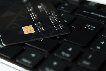 Credit card on a computer keyboard, close-up. Internet purchase